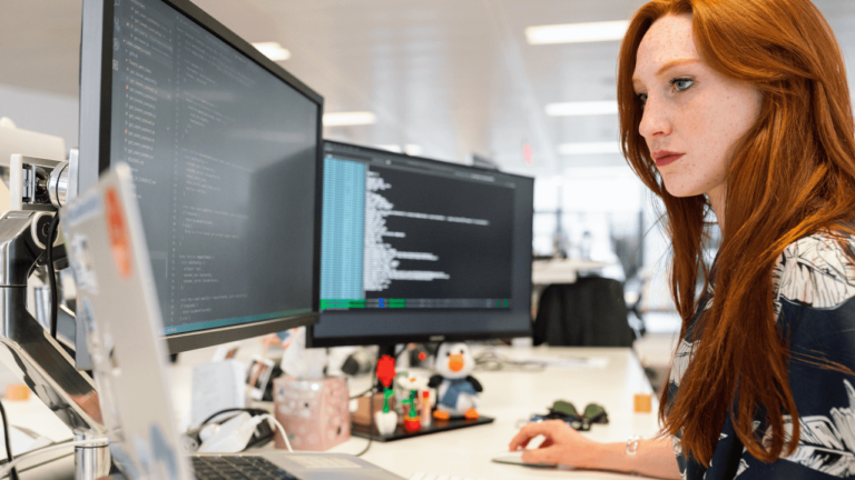 Localization engineer in front of a computer